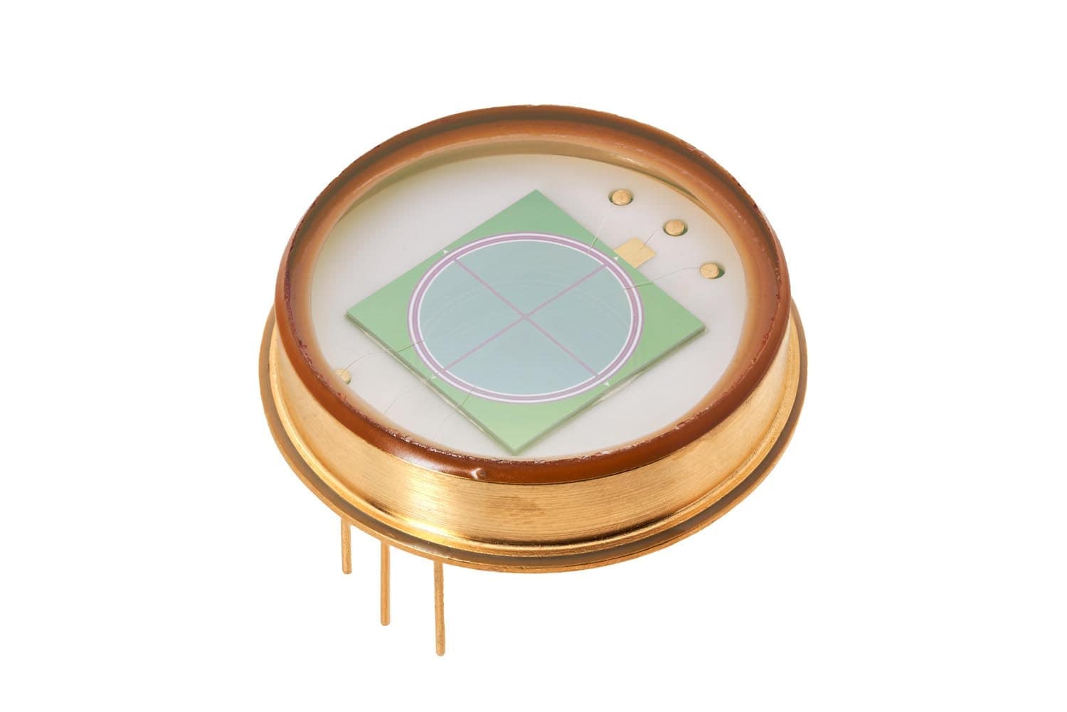 Gold can with a wide window over a large round die on a green substrate
